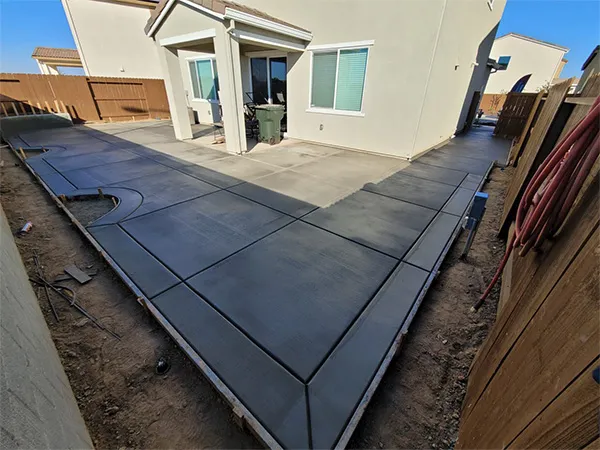 Broom-finished concrete slab with clean control joints at a Sacramento-area home